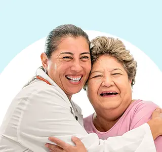 Two people embracing, representing support and care.